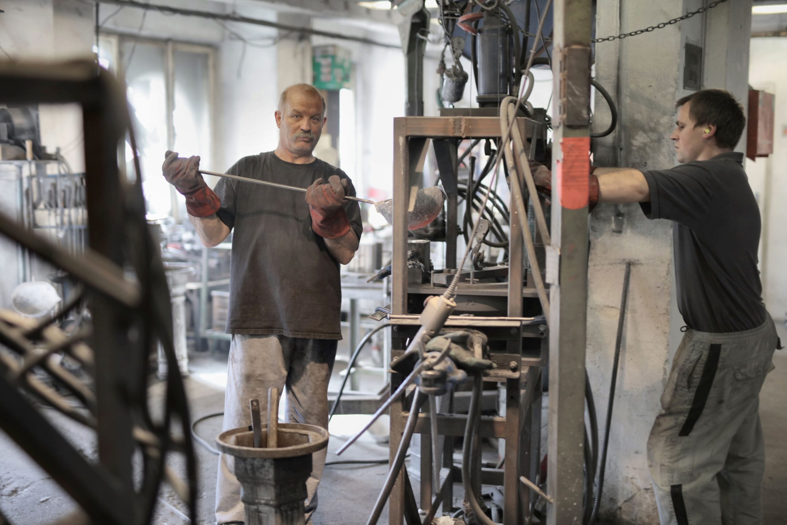 Industrial technicians servicing factory equipment